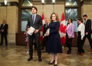 Canada's Prime Minister Justin Trudeau and Finance Minister Chrystia Freeland pose for a picture holding the 2024-25 budget in Ottawa