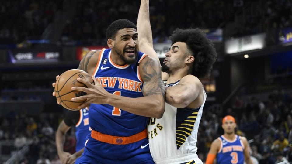 Apr 5, 2023; Indianapolis, Indiana, USA; New York Knicks forward Obi Toppin (1) drives against Indiana Pacers forward Jordan Nwora (13) during the first half at Gainbridge Fieldhouse.