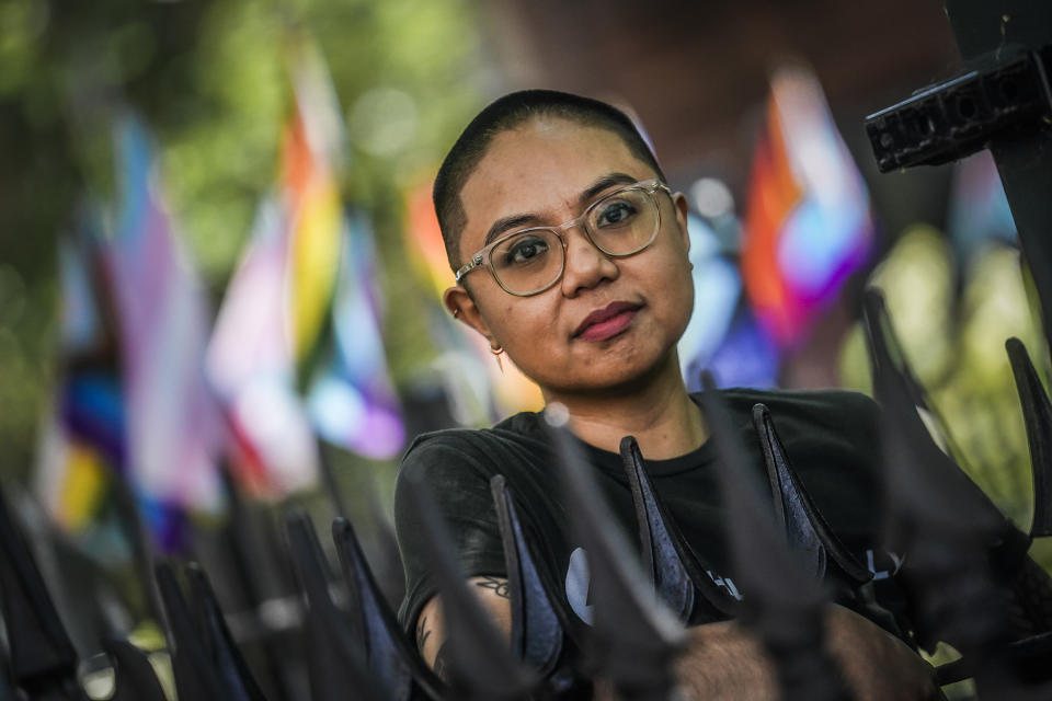 AC Dumlao, chief of staff for Athlete Ally, a group that advocates on behalf of LGBTQ+ and intersex athletes, and a transgender, nonbinary Filipino American, stands for a portrait in New York on Wednesday, May 31, 2023. They will be one of the grand marshals for the 2023 NYC Pride March. (AP Photo/Bebeto Matthews)