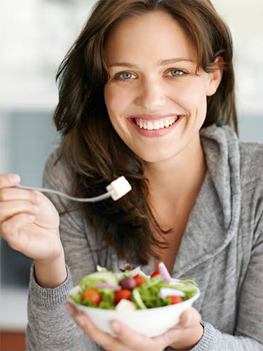 woman eating a salad