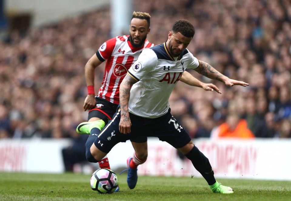 <p>Kyle Walker deals with the ball under pressure from Redmond </p>