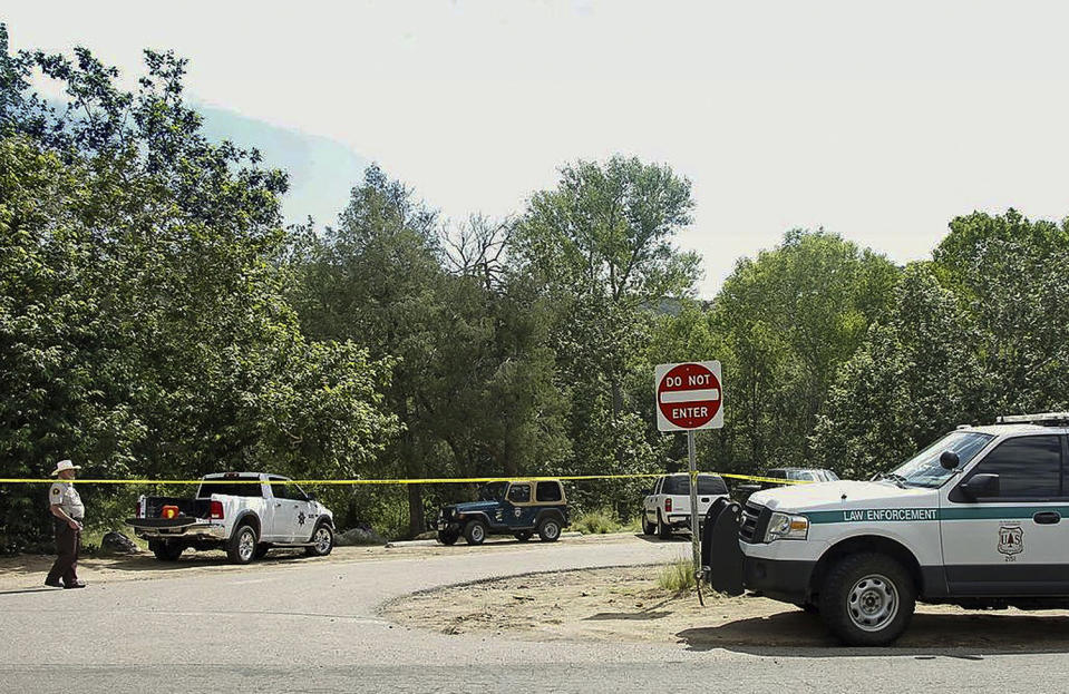 <p>The Water Wheel Campground parking lot is blocked off by authorities Sunday, July 16, 2017, in the Tonto National Forest, Ariz., after a deadly flash-flooding hit Saturday afternoon at Cold Springs canyon. (Alexis Bechman/Payson Roundup via AP) </p>