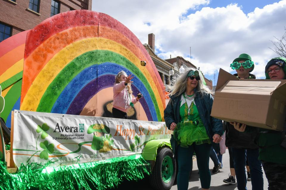 The Avera Health float passes out St. Patrick’s Day themed items to parade-goers on Saturday, March 16, 2024 along Phillips Avenue in Sioux Falls.