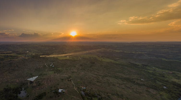 Farm land and a sunset.