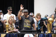 Denver Nuggets general manager Calvin Booth speaks during a rally and parade to mark the team's first NBA basketball championship on Thursday, June 15, 2023, in Denver. (AP Photo/David Zalubowski)