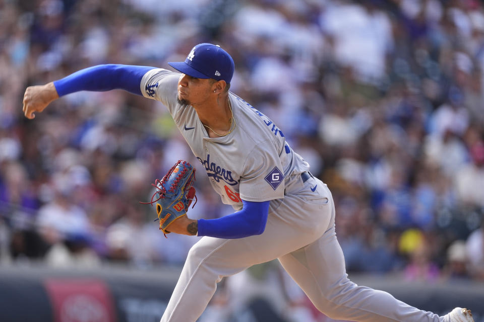 Los Angeles Dodgers relief pitcher Edgardo Henriquez works against the Colorado Rockies in the ninth inning of a baseball game, Sunday, Sept. 29, 2024, in Denver. (AP Photo/David Zalubowski)