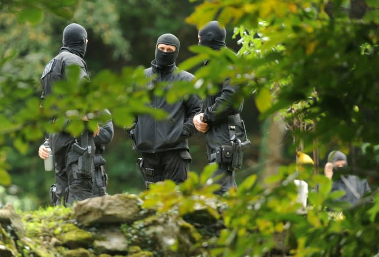 Officers from the anti-terrorist unit of the French National Police (RAID) stand guard on September 22, 2015, during the arrest of the suspected leaders of Basque armed separatist group ETA