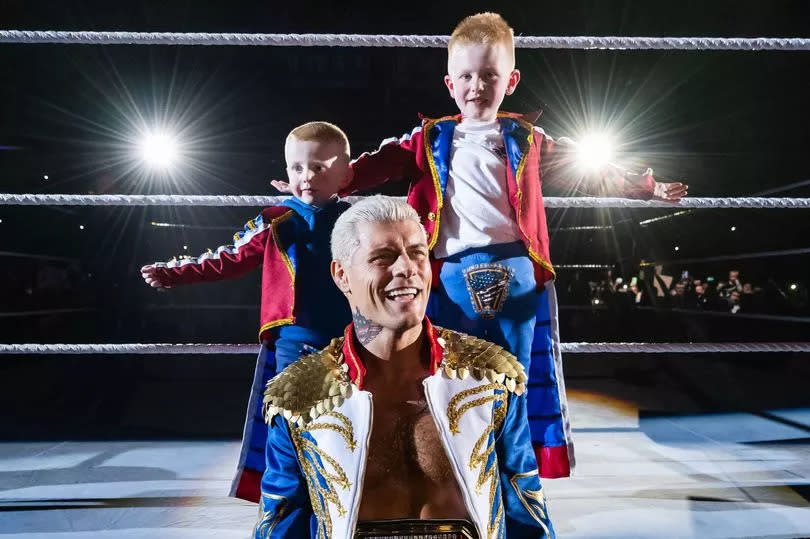 Ollie Beverland, his brother Carson with Cody Rhodes at SSE Arena in Belfast