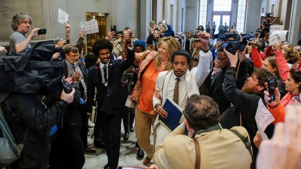 PHOTO: Tennessee State Representative Justin Pearson, Gloria Johnson and Justin Jones hold hands as they walk in the State House in Nashville, Tenn., April 6, 2023. (Reuters)