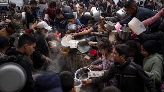 Palestinians line up for food in Rafah, Gaza Strip.