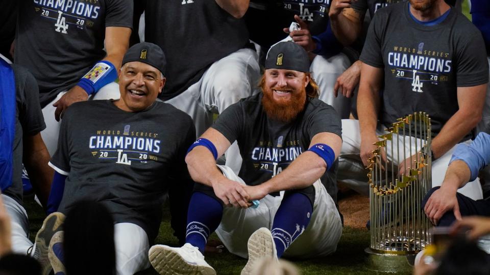Mandatory Credit: Photo by Eric Gay/AP/Shutterstock (10996083b)Los Angeles Dodgers manager Dave Roberts, left foreground, sits beside third baseman Justin Turner as they pose for a group picture after the Dodgers defeated the Tampa Bay Rays 3-1 in Game 6 to win the baseball World Series in Arlington, Texas.