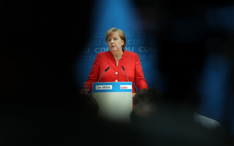 Angela Merkel speaks to the media following two days of talks about migration among her party's leadership  - Getty Images Europe