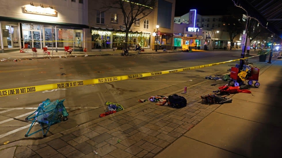 Police tape cordons off a street in Waukesha, Wis., after an SUV plowed into a Christmas parade hitting multiple people