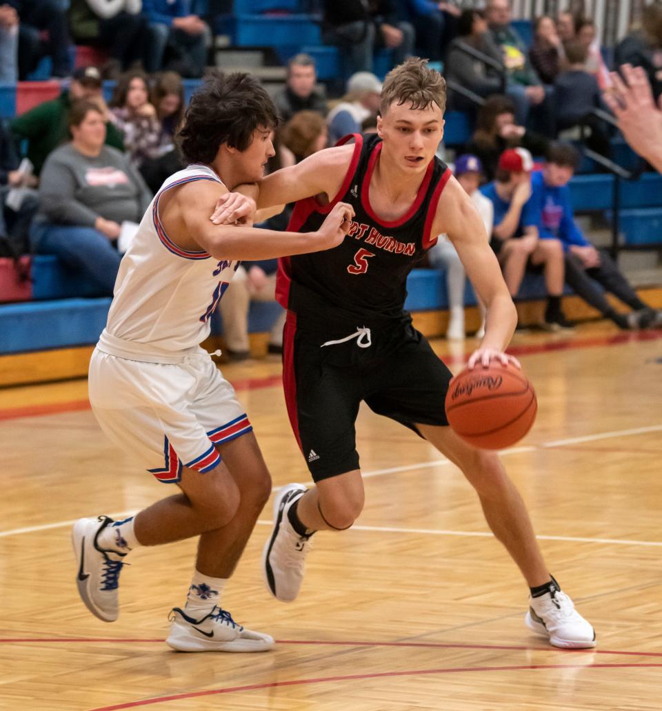 Port Huron’s Connor Rosenau drives to the basket during a game last season. He scored eight points in the Big Reds' 53-42 loss to Utica on Wednesday.
