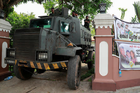Soldiers stand guard on an armoured vehicle outside St. Sebastian Church, days after a string of suicide bomb attacks across the island on Easter Sunday, in Negombo, Sri Lanka, May 1, 2019. REUTERS/Danish Siddiqui