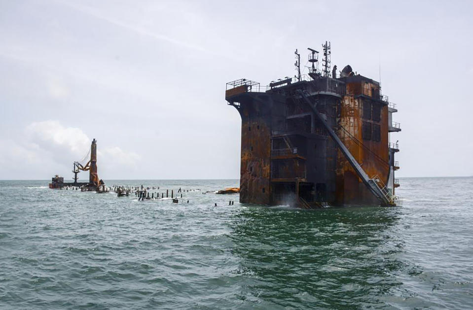 This photo provided by Sri Lankan Navy shows the sinking MV X-Press Pearl off Colombo port, Sri Lanka, Thursday, June 17, 2021. The container ship carrying chemicals sank off Sri Lanka’s capital on Thursday nearly a month after catching fire, raising concerns about a possible environmental disaster. The ship's operator said the wreck of the Singapore-flagged X-Press Pearl "is now wholly sitting on the seabed at a depth of 21 meters (70 feet).” (Sri Lanka Navy via AP)