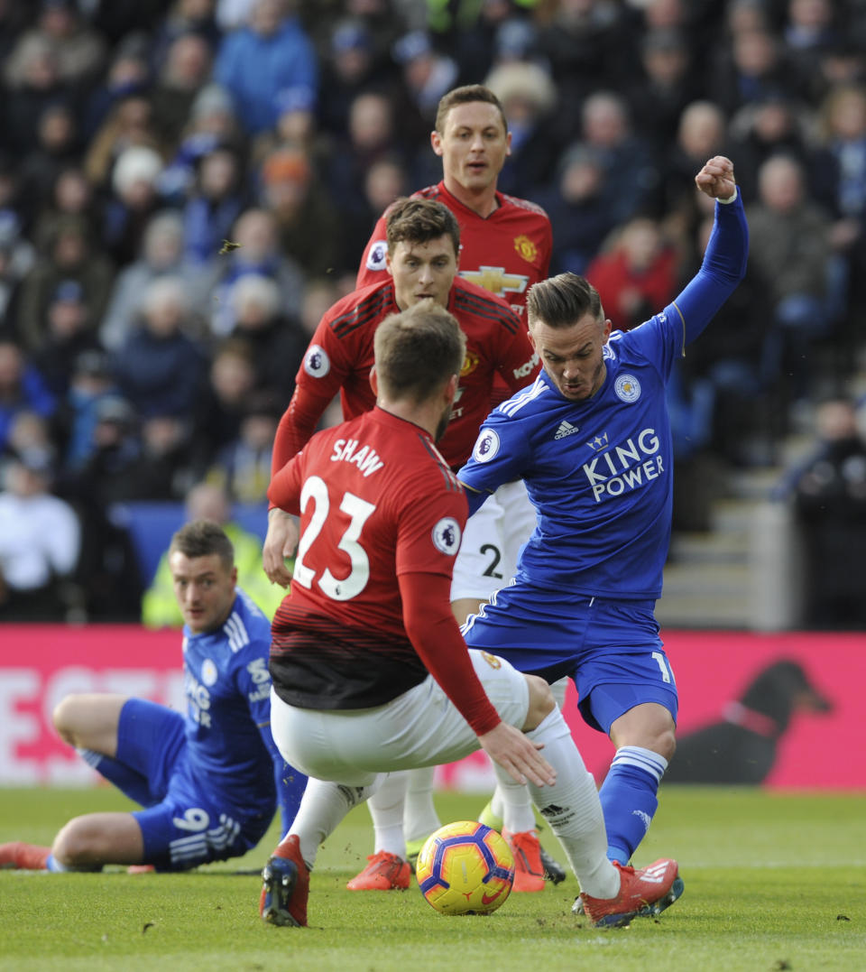Leicester's James Maddison, right, and Manchester United's Luke Shaw challenge for the ball during the English Premier League soccer match between Leicester City and Manchester United at the King Power Stadium in Leicester, England, Sunday, Feb 3, 2019. (AP Photo/Rui Vieira)