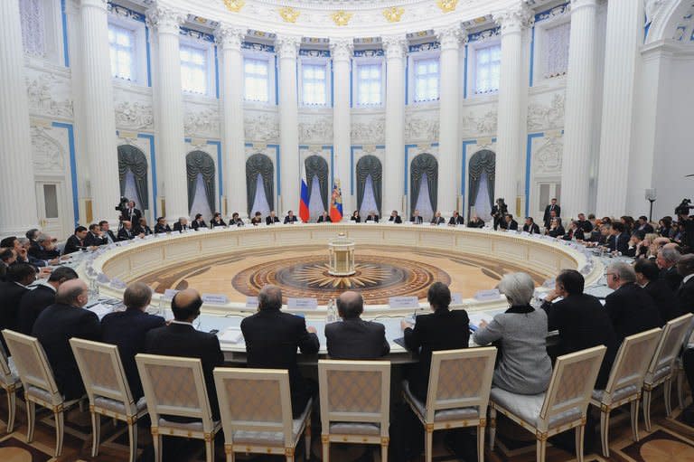 Russian President Vladimir Putin speaks to G20 states finance ministers in the Kremlin in Moscow on February 15, 2013. G20 finance ministers have pledged to crack down on corporate tax avoidance and not to target specific exchange rate values that could spark a currency war, the final communique said