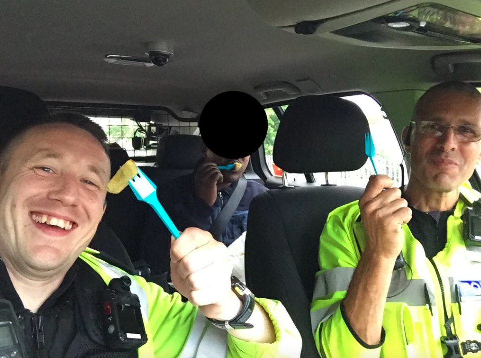 <em>PC Kieran Dempsey and PC Charlie Amodio shared a selfie of themselves eating a bag of chips with the suspected illegal immigrant (Twitter/@LeicsPoliceRPU)</em>