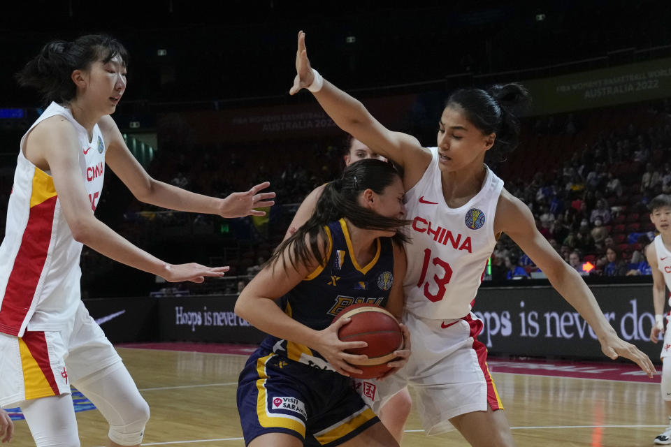 Bosnia and Herzegovina's Dragana Domuzin collides with China's Dilana Dilixiati, right, during their game at the women's Basketball World Cup in Sydney, Australia, Friday, Sept. 23, 2022. (AP Photo/Mark Baker)