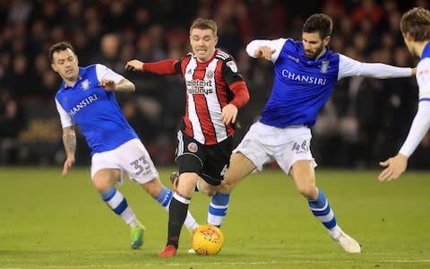 United's John Fleck and Sheffield Wednesday's Frederico Venancio (right) and Ross Wallace battle for the ball - Credit:  Danny Lawson/PA Wire