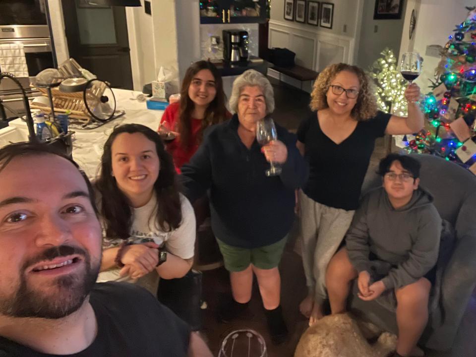 The Veiga family, a family in front of their Christmas Tree