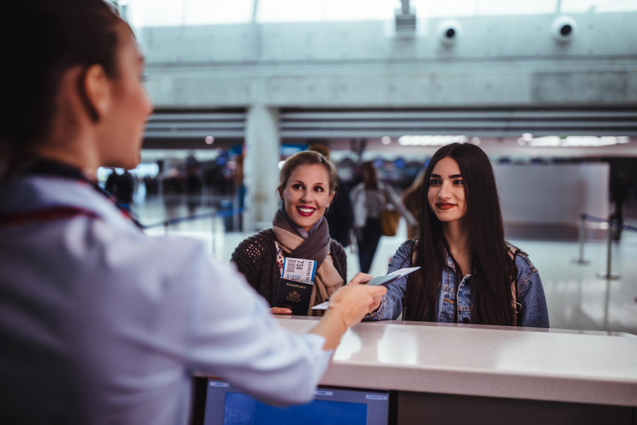 Airline hands woman ticket