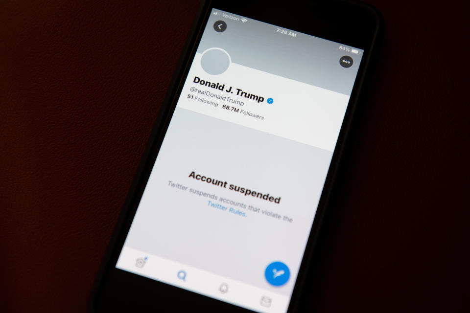 The suspended Twitter Inc. account of U.S. President Donald Trump on a smartphone arranged in Washington, D.C., U.S., on Saturday, Jan. 9, 2021.  / Credit: Graeme Sloan/Bloomberg via Getty Images