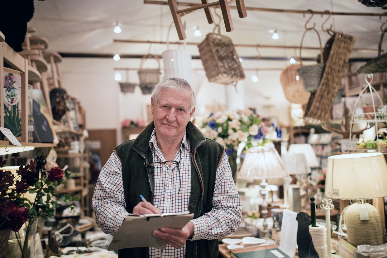 Retired man working in an antique shop