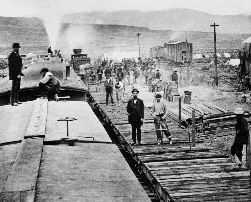Workers laying tracks for Central Pacific Railroad pause for a moment at camp 