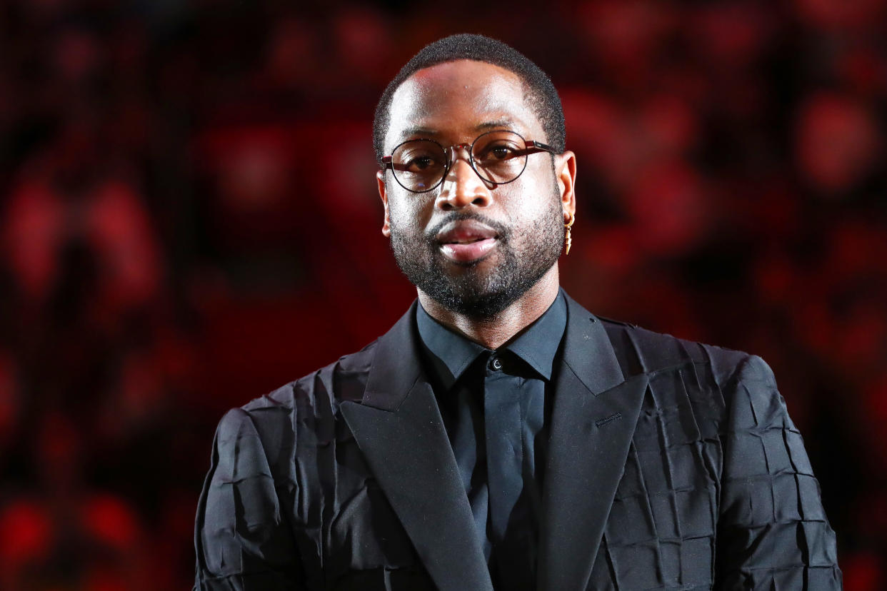 Feb 22, 2020; Miami, Florida, USA; Miami Heat former player Dwyane Wade reacts during the second quarter at American Airlines Arena. Mandatory Credit: Kim Klement-USA TODAY Sports