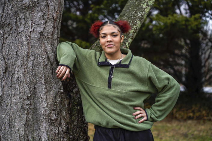 Kailani Taylor-Cribb stands for a portrait outside her home in Asheville, N.C., on Tuesday, Jan. 31, 2023. She has ADHD and says the white teaching assistant assigned to help her focus in her new class targeted her because she’s Black, blaming Kailani when classmates acted up. She also didn’t allow Kailani to use her headphones while working independently in class, something permitted in her special education plan to help her focus, according to Kailani. (AP Photo/Kathy Kmonicek)