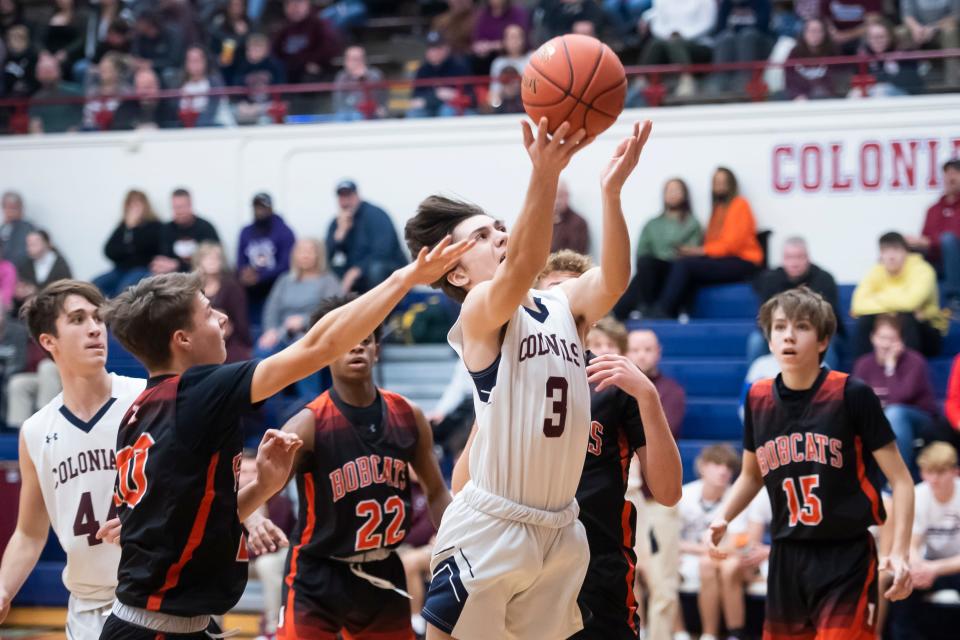 New Oxford's Idriz Ahmetovic (3) is fouled as he goes up for a layup in the third quarter of a YAIAA Division I basketball game against Northeastern on Jan. 7, 2022, at New Oxford High School. The Bobcats won, 59-35. 