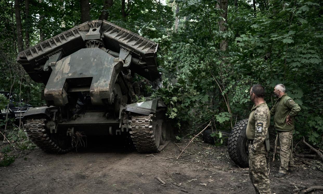 <span>A Ukrainian mine-clearing vehicle moves to the border with Russia on 14 August in the Sumy region of Ukraine.</span><span>Photograph: Libkos/Getty Images</span>