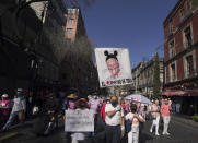 Anti-government demonstrators march against recent reforms pushed by President Andres Manuel Lopez Obrador to the country's electoral law that they say threaten democracy, towards Mexico City's main square, The Zocalo, Sunday, Feb. 26, 2023. (AP Photo/Fernando Llano)