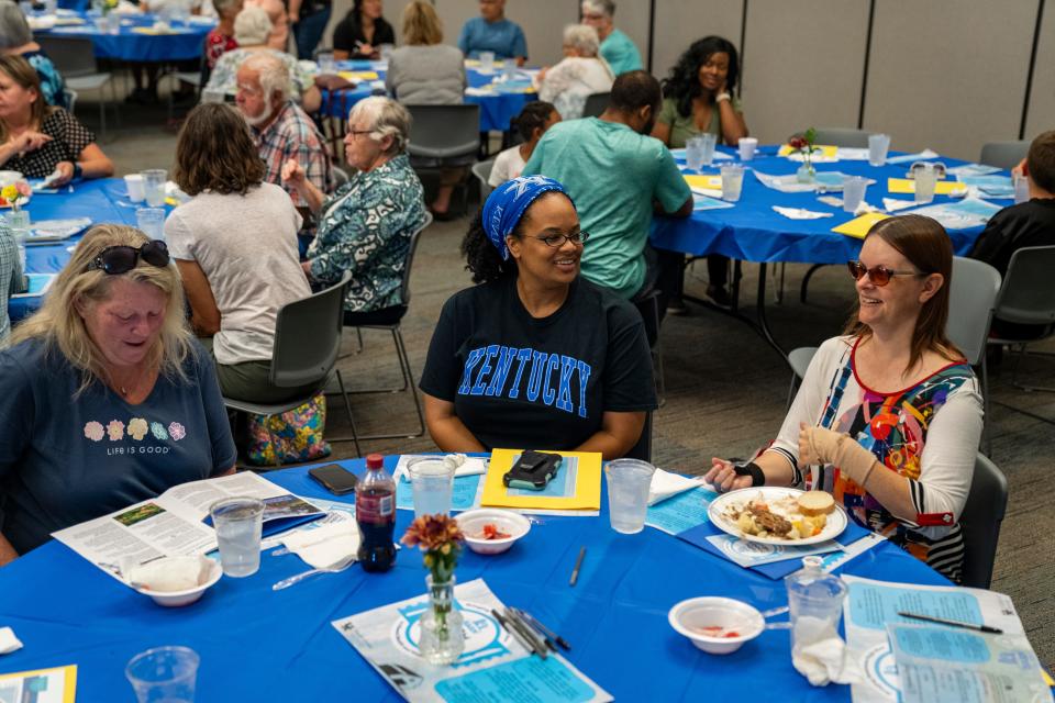 From left, Lisa Switalski, Laila El-Amin and Tiffany Tanner were among the audience at the Farmers’ Dinner Theater on Aug. 31, 2023, in Boone County, Kentucky. Farmers' Dinner Theaters helps bring awareness to rural health and safety issues in an informal setting.