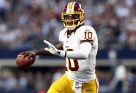 ARLINGTON, TX - NOVEMBER 22: Robert Griffin III #10 of the Washington Redskins throws the ball against the Dallas Cowboys during a Thanksgiving Day game at Cowboys Stadium on November 22, 2012 in Arlington, Texas. (Photo by Ronald Martinez/Getty Images)