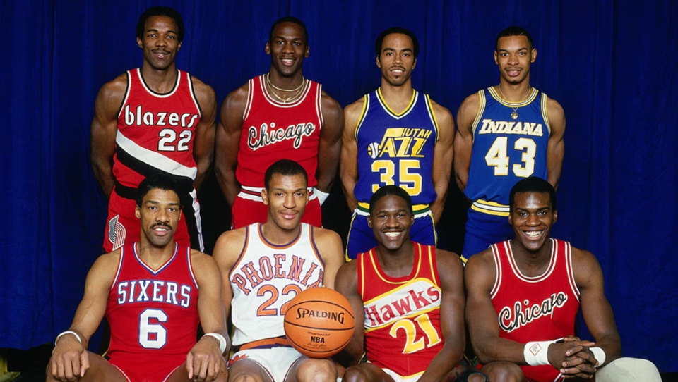 NBA Slam Dunk Contest participants in 1985, clockwise from top left: Clyde Drexler, Michael Jordan, Darrell Griffith, Terence Stansbury, Orlando Woolridge, Dominique Wilkins, Larry Nance and Julius Erving.