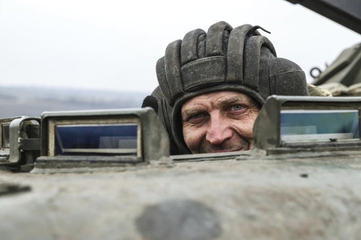 A Ukrainian soldier looks out of an APC during combat training in Zaporizhzhia region, Ukraine, Tuesday, Jan. 24, 2023. (AP Photo/Kateryna Klochko)