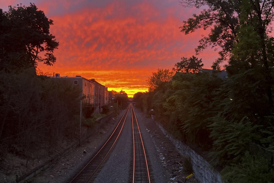 The sun sets Friday, Sept. 15, 2023, in Cambridge, Mass., ahead of expected stormy weather as the region prepares for the anticipated arrival of Hurricane Lee. (AP Photo/Steve LeBlanc)