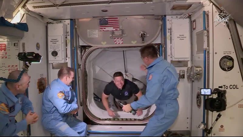 FILE PHOTO: NASA astronaut Bob Behnken arrives at the International Space Station aboard SpaceX's Crew Dragon capsule in this still image taken from video