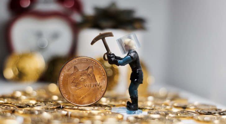 A concept image of a miner and a Dogecoin (DOGE) physical token.