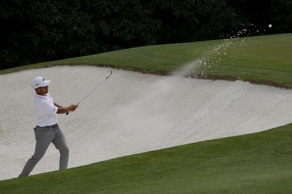 Xander Schauffele hits out of a bunker on the fifth hole during the final round of the Masters golf tournament on Sunday, April 11, 2021, in Augusta, Ga. (AP Photo/Gregory Bull)