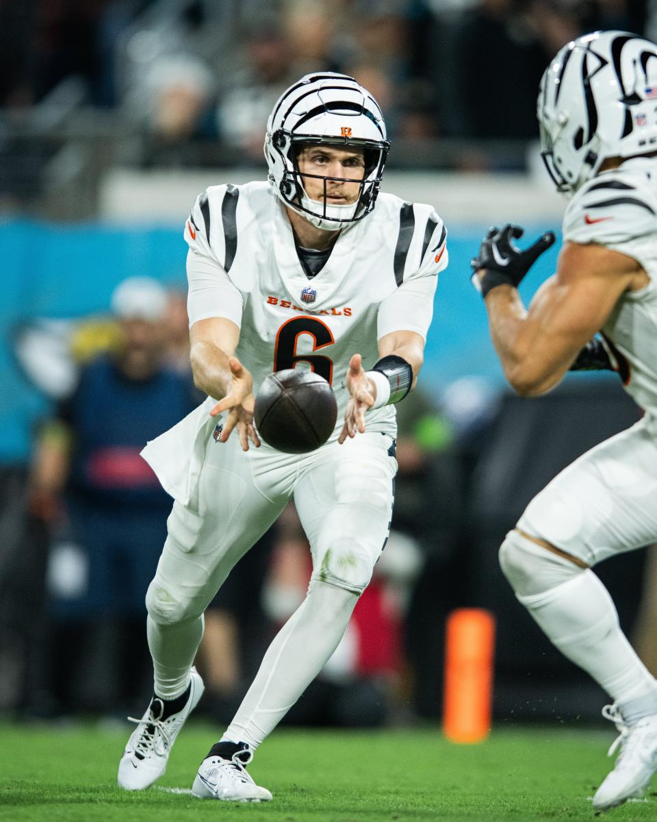 Week 13: Cincinnati Bengals quarterback Jake Browning pitches the ball against the Jacksonville Jaguars at EverBank Stadium. The Bengals wore their "White Bengal" uniforms for the 34-31 overtime win on "Monday Night Football."