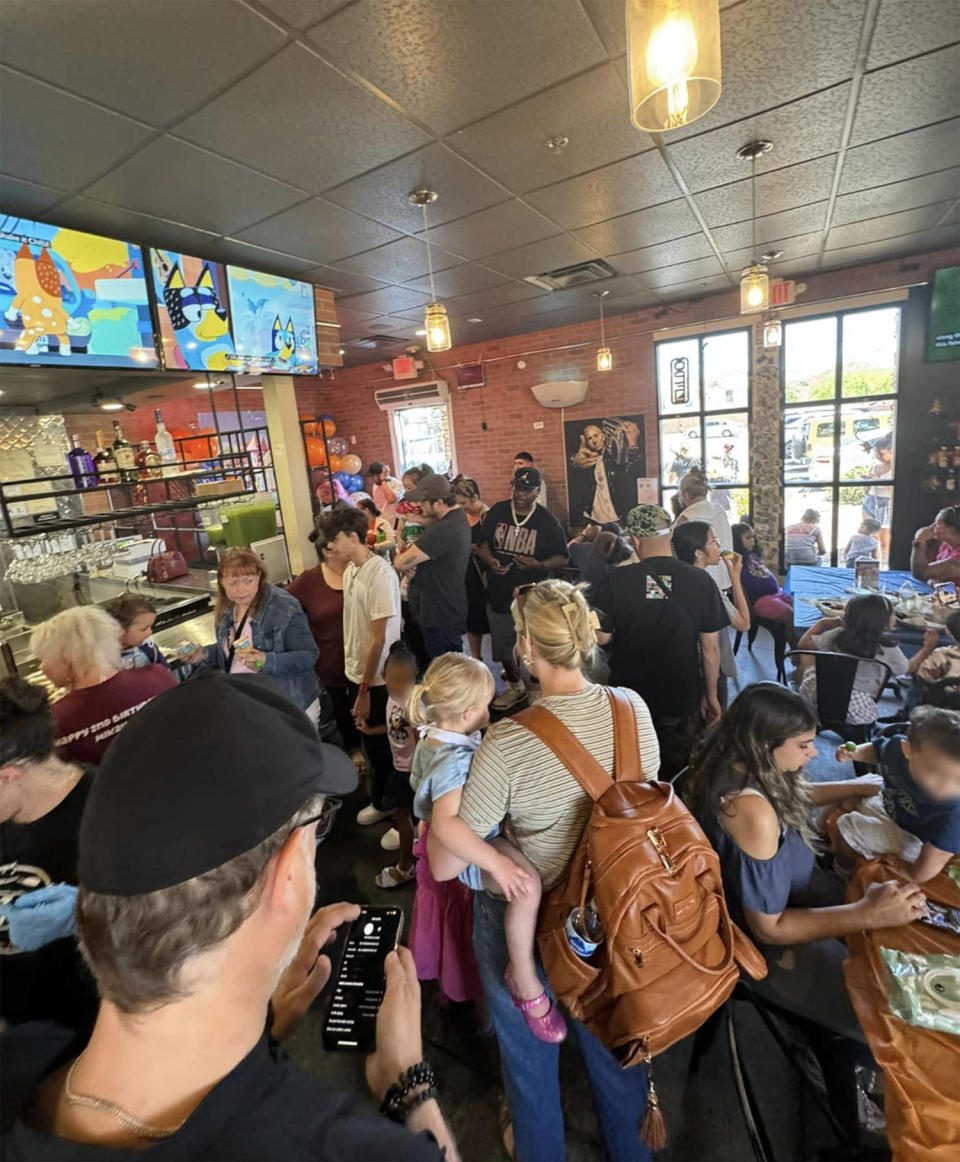 crowd of people inside a bluey themed restaurant  (Courtesy Maria Hardly)