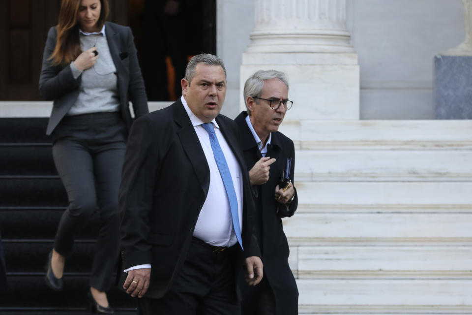 Greek Defense Minister Panos Kammenos leaves Maximos mansion following a meeting with Greece's Prime Minister Alexis Tsipras, in Athens, Sunday, Jan. 13, 2019. Greek defense Minister Kammenos, leader of the right-wing populist Independent Greeks party, is vehemently opposed to a deal with neighboring Macedonia over its state name. (AP Photo/Yorgos Karahalis)