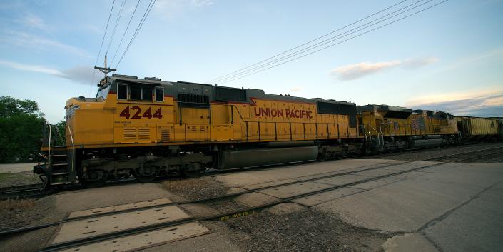 Union Pacific train hauling bulk grain cars passes thru the town of Osawatomie Kansas, 2014