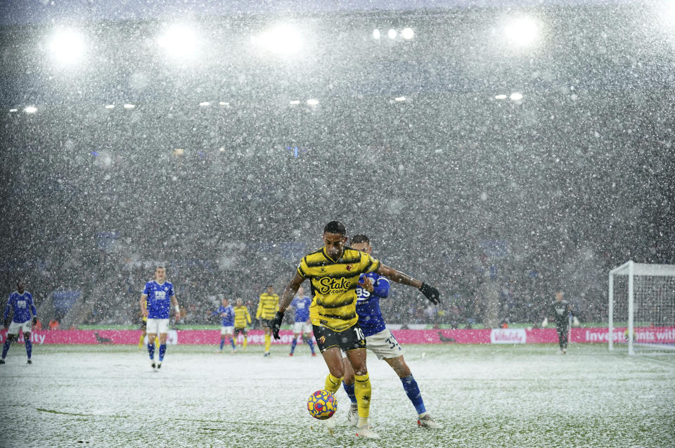 Watford's Joao Pedro, left, and Leicester City's Luke Thomas go for the ball during the English Premier League soccer match between Watford and Leicester City at the King Power Stadium, Watford, England, Sunday, Nov. 28, 2021. (Tim Goode/PA via AP)