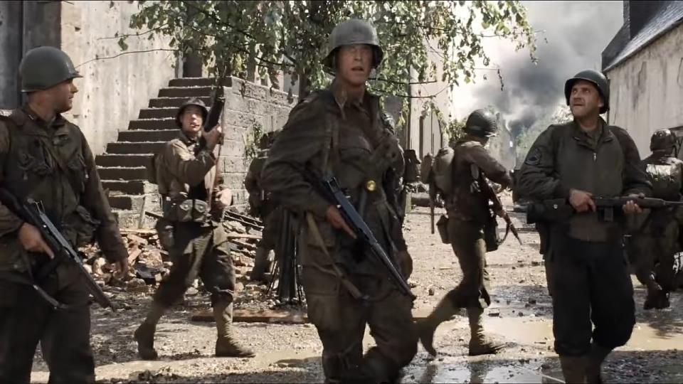 Captain Miller and his team walking through a ruined town in "Saving Private Ryan"