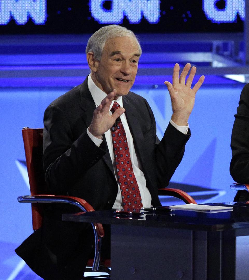 Republican presidential candidate, Rep. Ron Paul, R-Texas, gestures during a Republican presidential debate Wednesday, Feb. 22, 2012, in Mesa, Ariz. (AP Photo/Jae C. Hong)